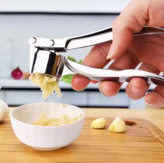 Handheld garlic crusher designed for convenient everyday cooking.